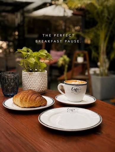 A croissant and a cappuccino on a Soul Café table